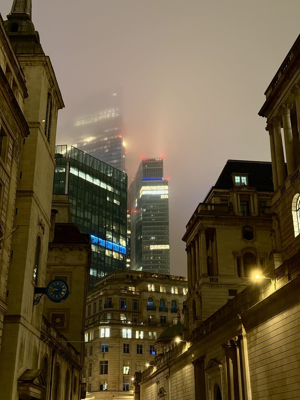 City of London towers in fog at night, in black and white